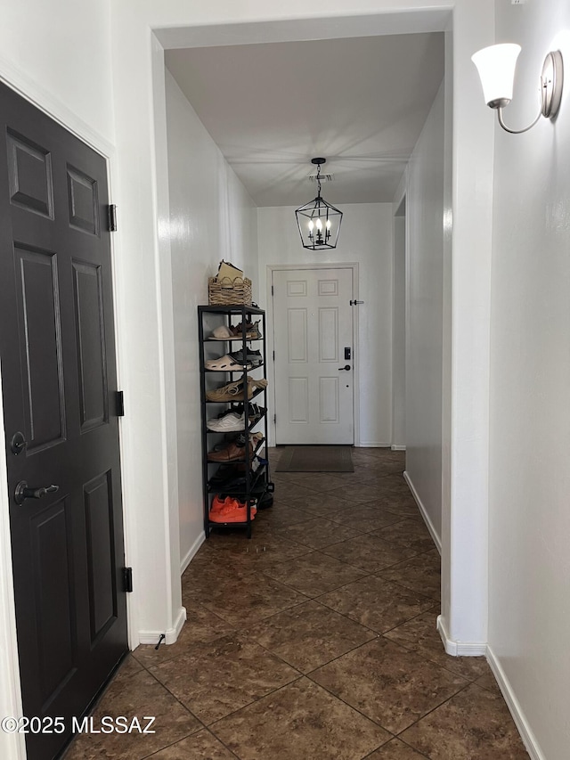210 W Andrew Potter St, Vail, AZ 85641 - foyer featuring baseboards and a chandelier