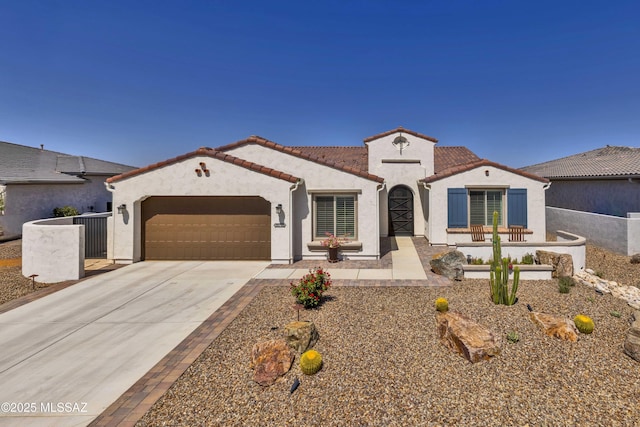 30755 S Chestnut Way, Oracle, AZ 85623 - mediterranean / spanish house featuring a garage, stucco siding, concrete driveway, and a tile roof