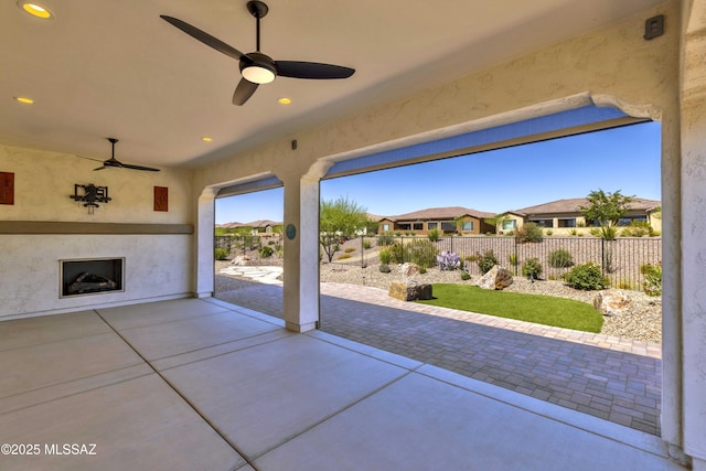 30755 S Chestnut Way, Oracle, AZ 85623 - fenced backyard with an outdoor fireplace, a patio, ceiling fan, and a residential view