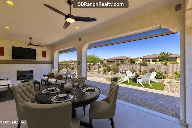 30755 S Chestnut Way, Oracle, AZ 85623 - view of patio featuring an outdoor fireplace, a residential view, and a ceiling fan