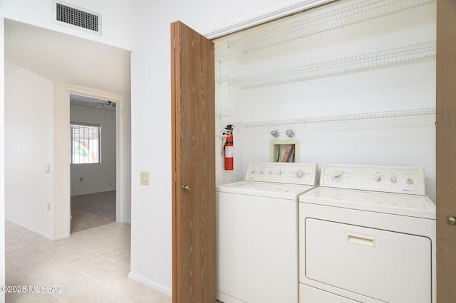 1438 W De Nada, Green Valley, AZ 85622 - laundry area featuring separate washer and dryer, light tile patterned floors, and light carpet