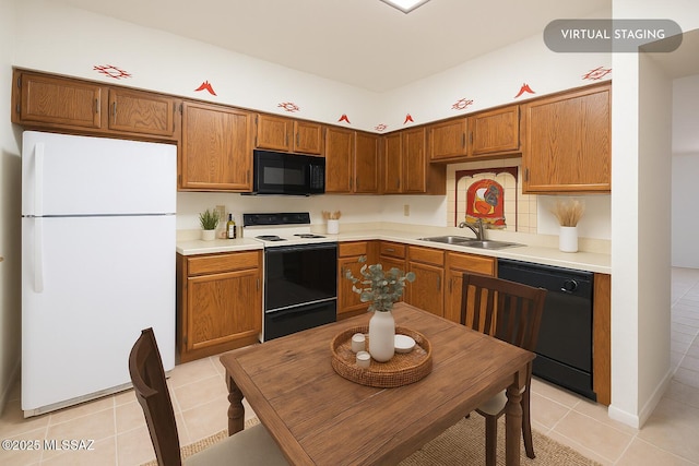 1438 W De Nada, Green Valley, AZ 85622 - kitchen with black appliances, light tile patterned flooring, light countertops, and brown cabinetry