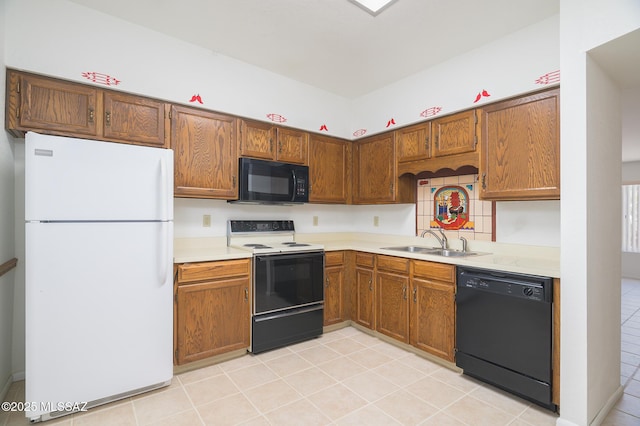 1438 W De Nada, Green Valley, AZ 85622 - kitchen featuring black appliances, light countertops, light tile patterned floors, and brown cabinetry