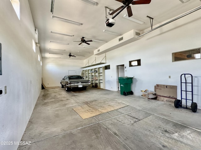 7621 N Placita De Los Amigos, Tucson, AZ 85704 - garage with ceiling fan and a garage door opener