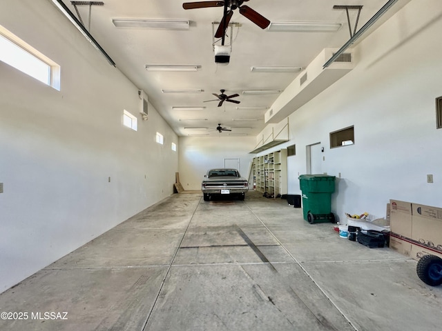 7621 N Placita De Los Amigos, Tucson, AZ 85704 - garage with ceiling fan and a garage door opener