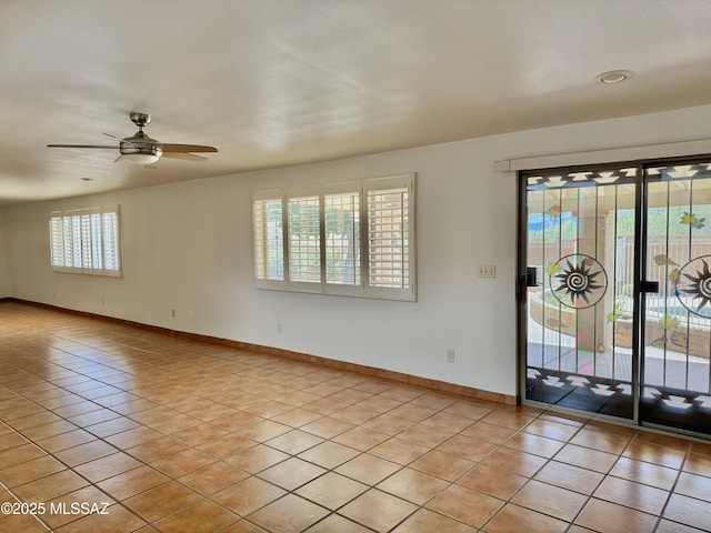 7621 N Placita De Los Amigos, Tucson, AZ 85704 - empty room featuring light tile patterned flooring and a ceiling fan