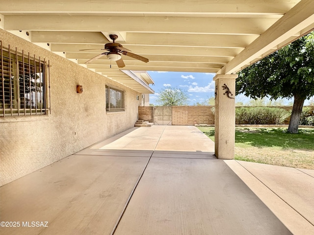 7621 N Placita De Los Amigos, Tucson, AZ 85704 - fenced backyard with a ceiling fan and a patio