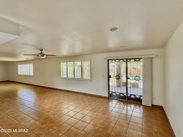 7621 N Placita De Los Amigos, Tucson, AZ 85704 - spare room featuring light tile patterned floors and ceiling fan