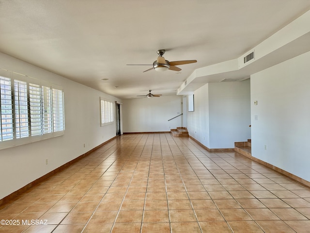 7621 N Placita De Los Amigos, Tucson, AZ 85704 - empty room with a ceiling fan and light tile patterned floors