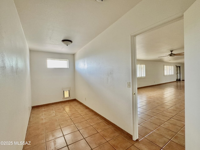 7621 N Placita De Los Amigos, Tucson, AZ 85704 - spare room featuring light tile patterned floors and ceiling fan
