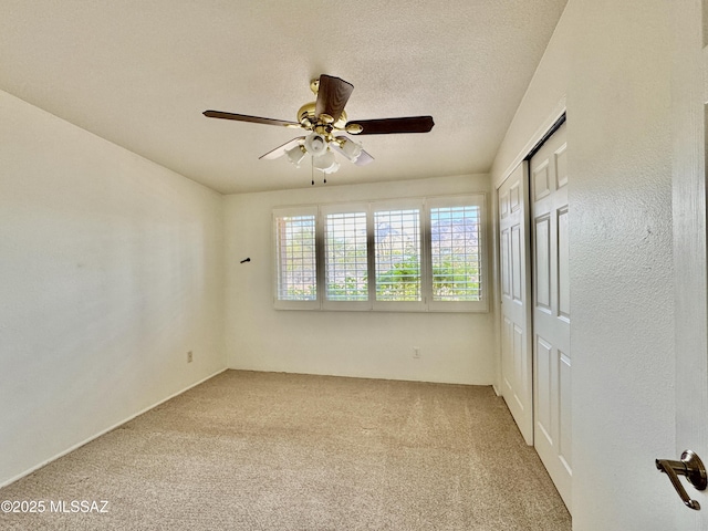 7621 N Placita De Los Amigos, Tucson, AZ 85704 - empty room featuring a ceiling fan and carpet floors