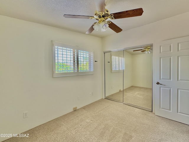 7621 N Placita De Los Amigos, Tucson, AZ 85704 - unfurnished bedroom featuring carpet floors, a closet, and a ceiling fan