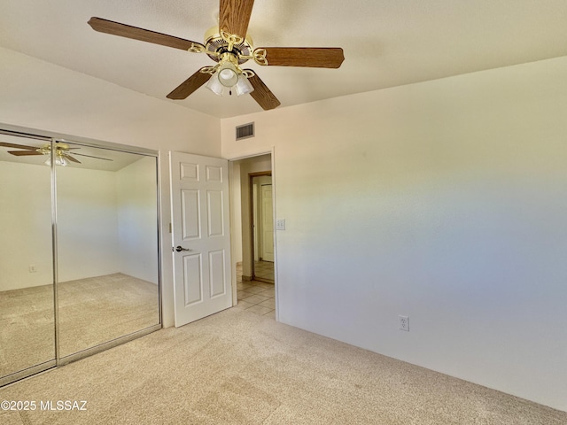 7621 N Placita De Los Amigos, Tucson, AZ 85704 - unfurnished bedroom with light carpet, a ceiling fan, and a closet