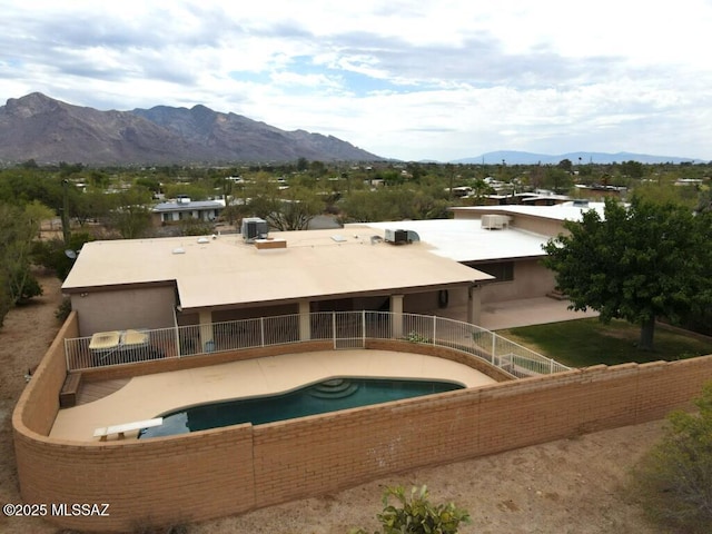 7621 N Placita De Los Amigos, Tucson, AZ 85704 - rear view of property featuring a mountain view and a patio