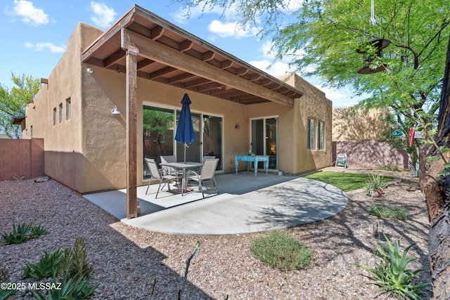 8984 E Wright School Loop, Tucson, AZ 85715 - rear view of house featuring stucco siding, a fenced backyard, and a patio