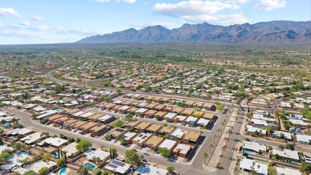 8984 E Wright School Loop, Tucson, AZ 85715 - aerial view of property and surrounding area featuring a mountain backdrop and nearby suburban area