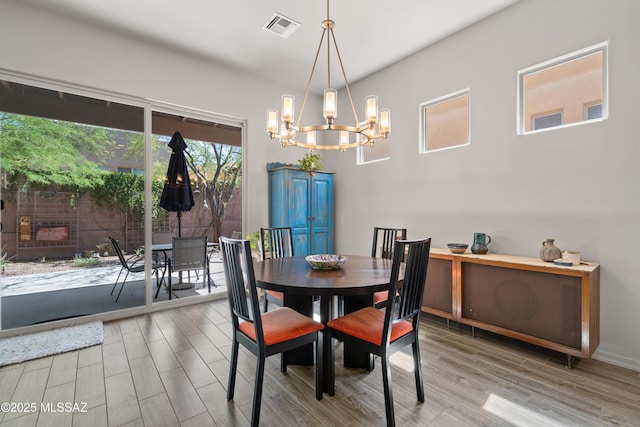 8984 E Wright School Loop, Tucson, AZ 85715 - dining area featuring a chandelier and wood finished floors