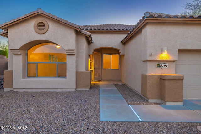 8191 N White Stallion Pl, Tucson, AZ 85743 - mediterranean / spanish house with stucco siding and a tiled roof