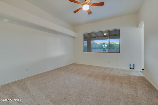 8191 N White Stallion Pl, Tucson, AZ 85743 - spare room with arched walkways, carpet, and ceiling fan