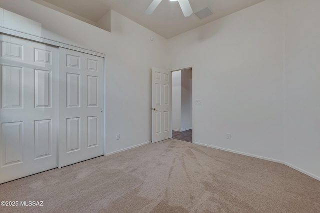 8191 N White Stallion Pl, Tucson, AZ 85743 - unfurnished bedroom with carpet flooring, a closet, and ceiling fan