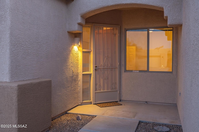 8191 N White Stallion Pl, Tucson, AZ 85743 - doorway to property with stucco siding