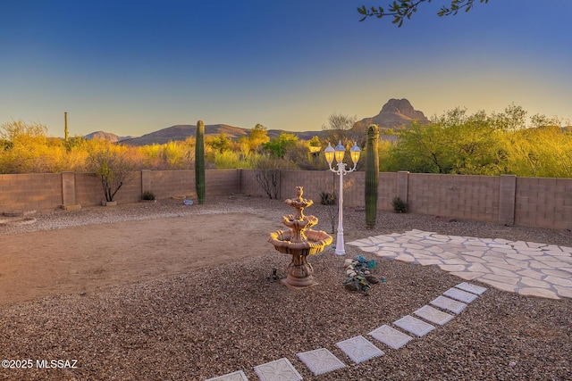8191 N White Stallion Pl, Tucson, AZ 85743 - fenced backyard featuring a patio area and a mountain view