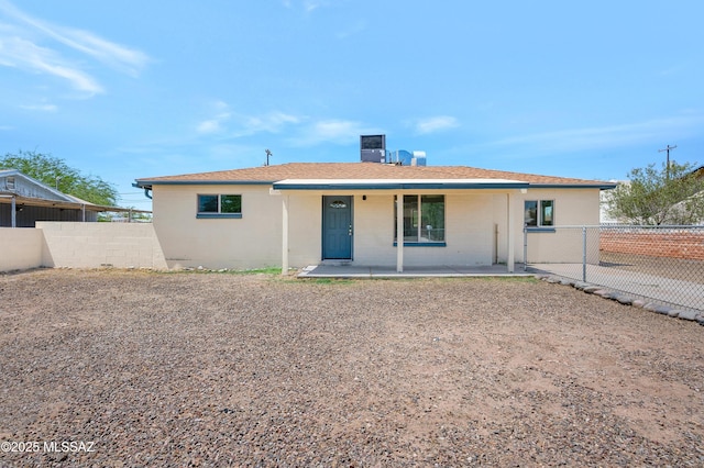 826 W Calle Margarita, Tucson, AZ 85706 - rear view of property with a chimney and roof with shingles