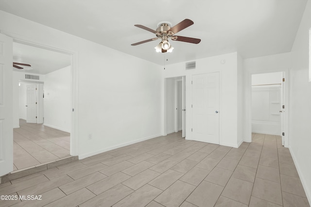826 W Calle Margarita, Tucson, AZ 85706 - unfurnished room with a ceiling fan and light tile patterned floors