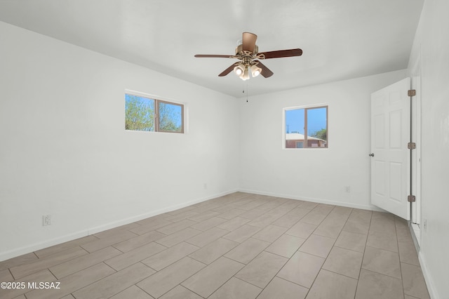 826 W Calle Margarita, Tucson, AZ 85706 - spare room with a ceiling fan and baseboards