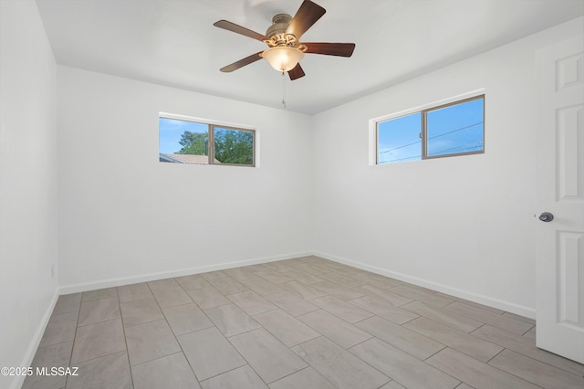 826 W Calle Margarita, Tucson, AZ 85706 - empty room with baseboards and a ceiling fan