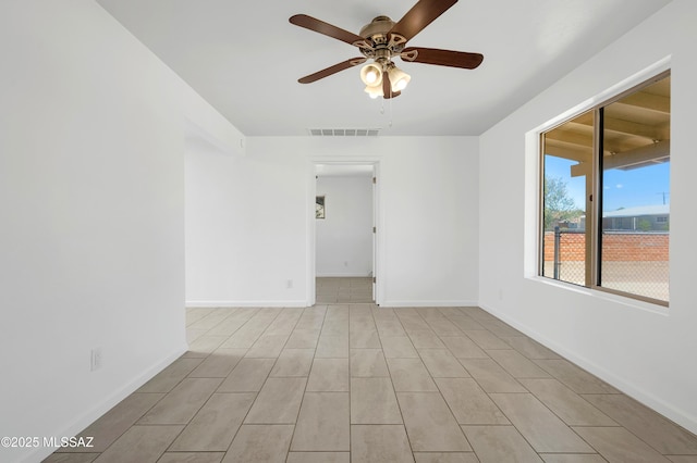 826 W Calle Margarita, Tucson, AZ 85706 - spare room featuring a ceiling fan and baseboards