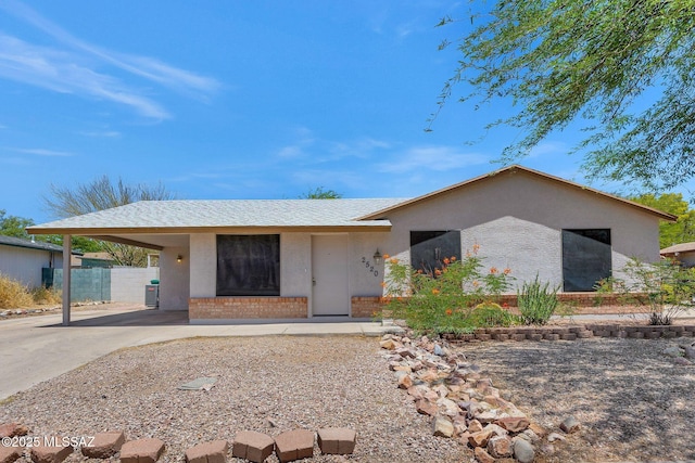 2520 W Vereda De Las Flores, Tucson, AZ 85746 - ranch-style home featuring driveway, an attached carport, stucco siding, and brick siding