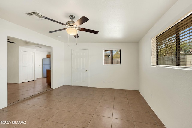 2520 W Vereda De Las Flores, Tucson, AZ 85746 - unfurnished room with ceiling fan and light tile patterned flooring