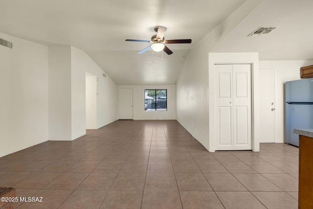 2520 W Vereda De Las Flores, Tucson, AZ 85746 - unfurnished room featuring a ceiling fan, light tile patterned floors, and vaulted ceiling
