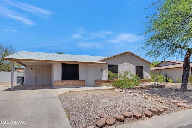 2520 W Vereda De Las Flores, Tucson, AZ 85746 - ranch-style house with a carport, stucco siding, and driveway