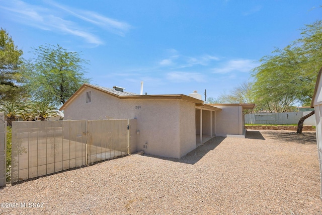 2520 W Vereda De Las Flores, Tucson, AZ 85746 - back of house featuring stucco siding and a patio