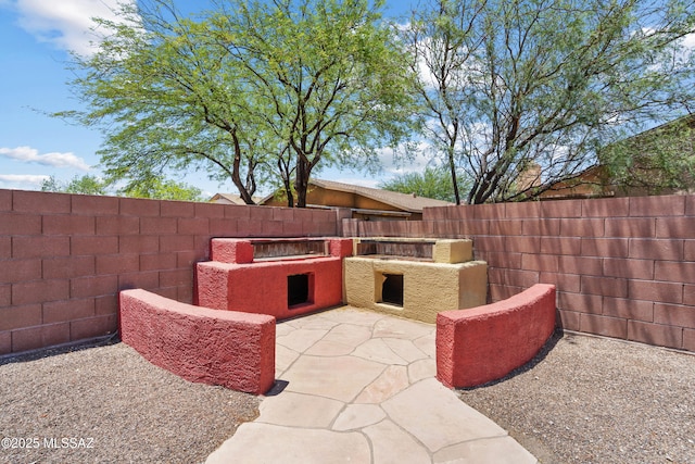 9969 E Apache Rain Dr, Tucson, AZ 85748 - fenced backyard with exterior kitchen and a patio area