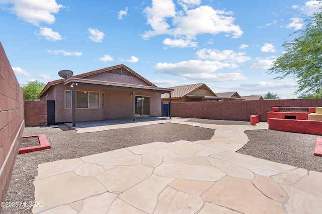 9969 E Apache Rain Dr, Tucson, AZ 85748 - back of house featuring a fenced backyard, stucco siding, and a patio