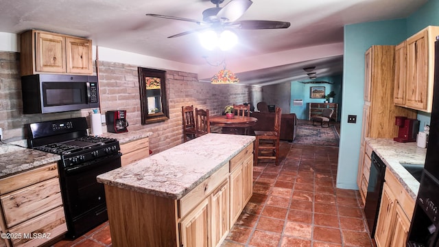 1094 N Pomerene Rd, Benson, AZ 85602 - kitchen with black appliances, light brown cabinetry, ceiling fan, a kitchen island, and light stone countertops