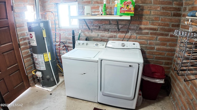 1094 N Pomerene Rd, Benson, AZ 85602 - washroom featuring gas water heater, washer and clothes dryer, and brick wall
