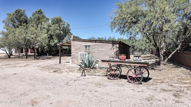 1094 N Pomerene Rd, Benson, AZ 85602 - rear view of property featuring stone siding