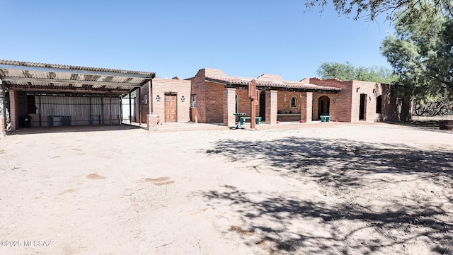 1094 N Pomerene Rd, Benson, AZ 85602 - view of front facade with a tiled roof and a detached carport
