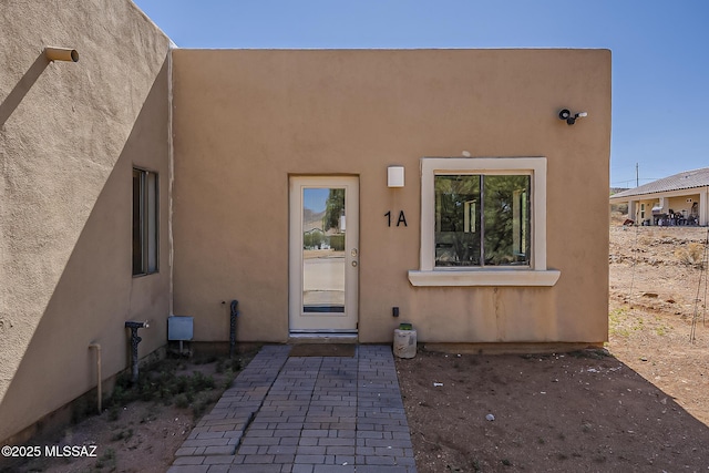 1503 Camino Bacalao, Rio Rico, AZ 85648 - doorway to property featuring stucco siding