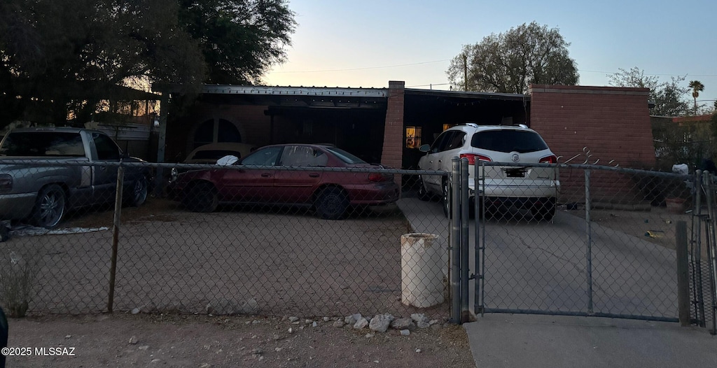 726 W Utah St, Tucson, AZ 85706 - view of front facade with a gate and uncovered parking