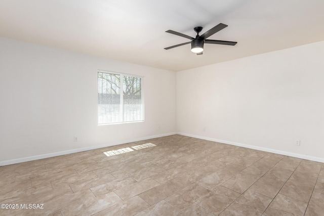 201 W Macarthur St, Tucson, AZ 85714 - unfurnished room featuring a ceiling fan and baseboards