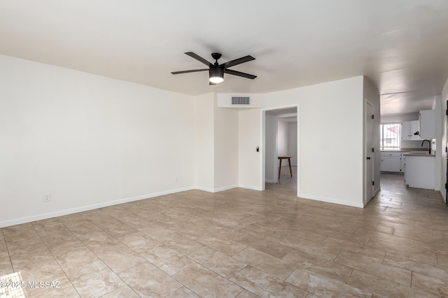 201 W Macarthur St, Tucson, AZ 85714 - unfurnished living room with ceiling fan and a sink
