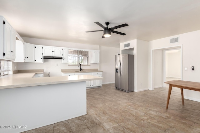 201 W Macarthur St, Tucson, AZ 85714 - kitchen featuring stainless steel fridge, a ceiling fan, a peninsula, light countertops, and white cabinets