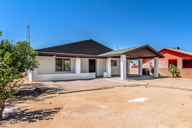 201 W Macarthur St, Tucson, AZ 85714 - back of house with brick siding and an attached carport