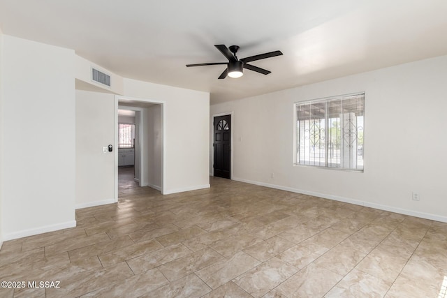 201 W Macarthur St, Tucson, AZ 85714 - spare room with a ceiling fan and baseboards