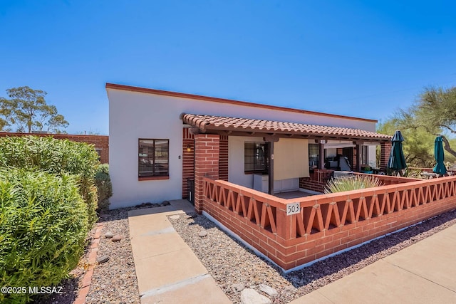 503 S Paseo Lobo Unit A, Green Valley, AZ 85614 - back of property featuring covered porch and stucco siding